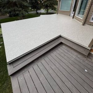 Custom deck with Duradek vinyl surface and composite lower step built by CBS Alberta in Edmonton