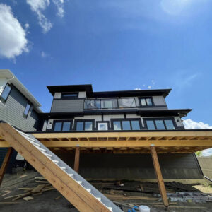 Upper deck with custom wood stairs and Flexstone waterproof surface built by CBS Alberta in Edmonton