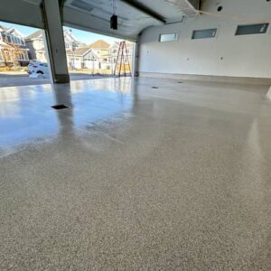 Glossy and durable polyaspartic floor coating applied to a garage in Edmonton