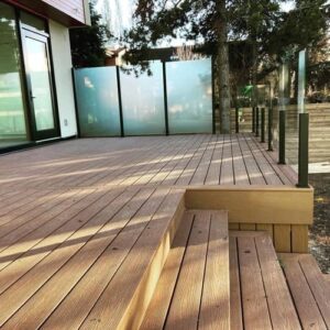 Composite deck with topless glass railings built by CBS Alberta in Edmonton