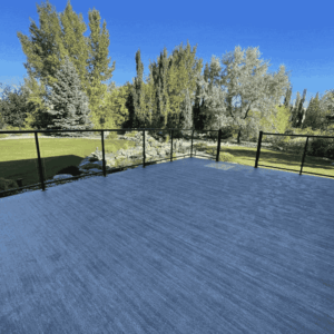 Duradek vinyl decking installation with glass railings on a residential deck in Edmonton